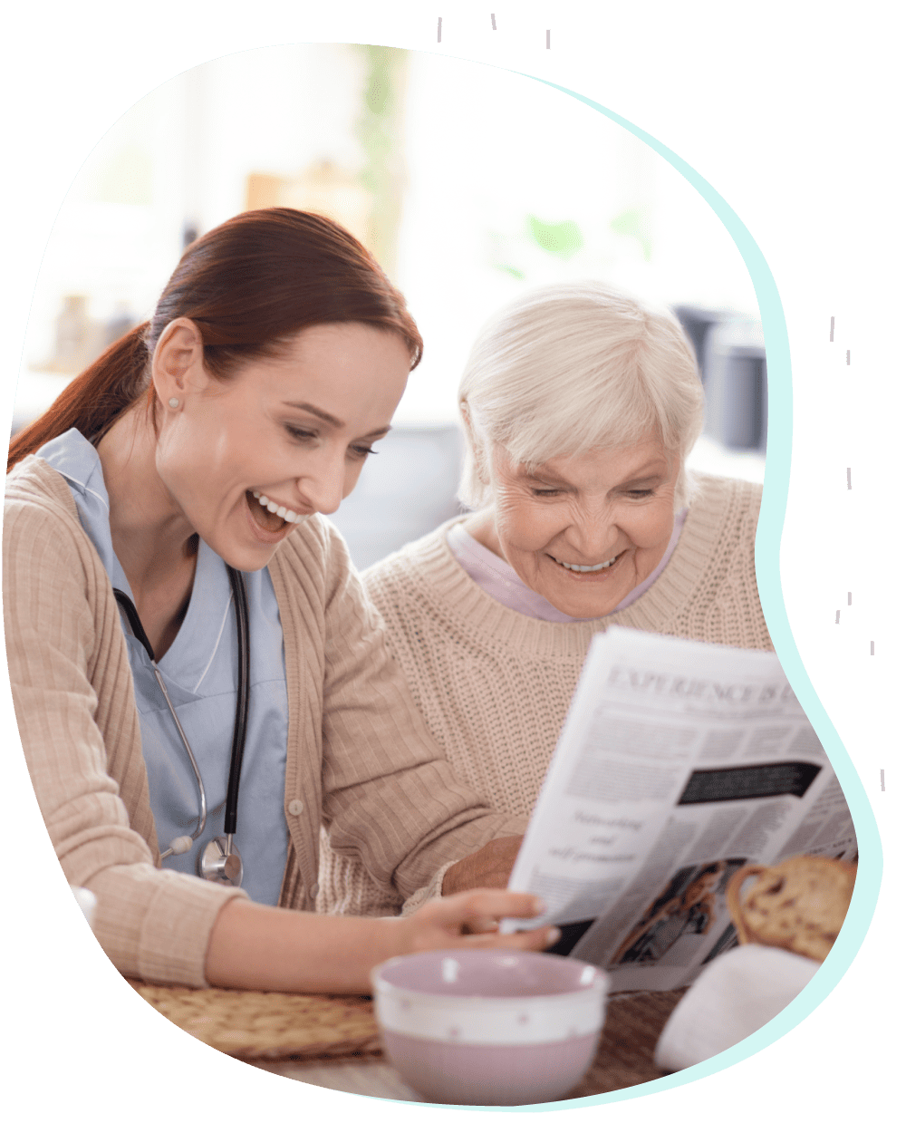 Caregiver and senior laughing