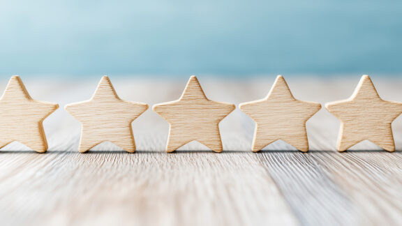 5 wooden stars on table