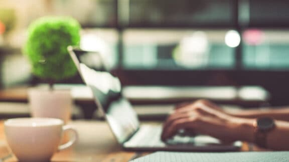 Person typing on laptop